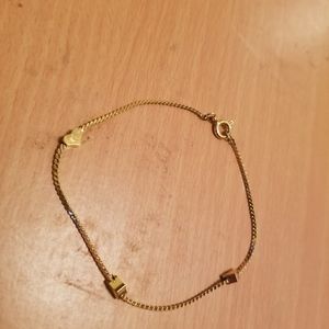 Gold bracelet with hearts